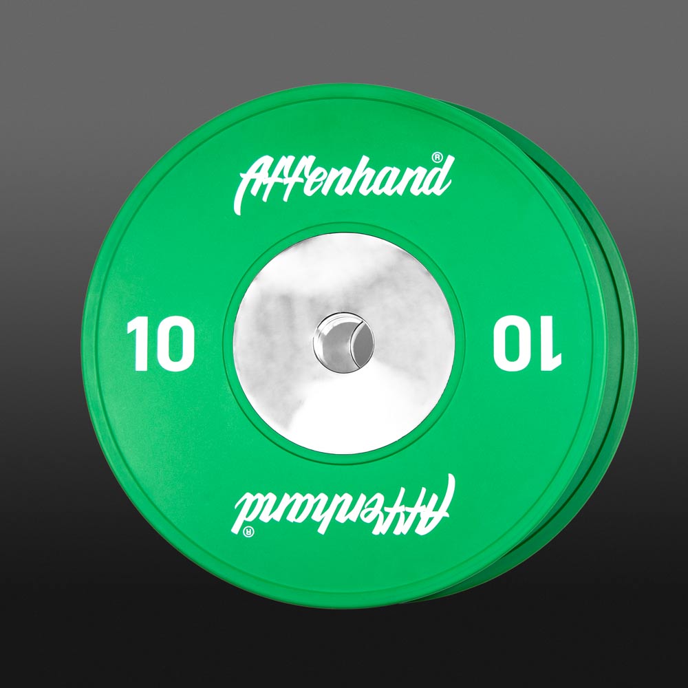Leuchtende grüne 10 kg Affenhand® Competition Plate auf schwarzem Hintergrund.